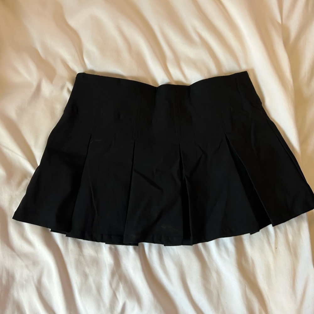 black pleated mini skirt
